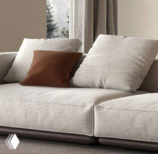 Макро-снимок посадочной поверхности и подушек дивана, демонстрирующий швы, наполнение и структуру обивки из хлопка и льна в нейтральной палитре.