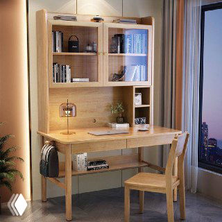 Письменный стол из массива дуба в светлом интерьере: столешница с полками, настольная лампа, книги и стул у окна с видом на город.