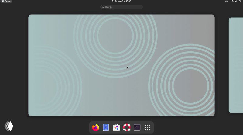 Общий вид рабочего стола CollabOS с абстрактным обоями в виде концентрических кругов и пустым рабочим пространством без окон.