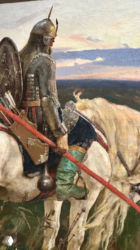 Фотография полотна на выставке Васнецова: всадник в латах и конь на фоне горизонта, переданы фактура щёлок и игры света на бронзе.