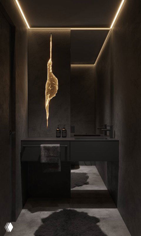 Матовый чёрный гостевой санузел: размытые границы стен, подвесная тумба-раковина и лампа с эффектом трещины в скале, создающие пещерную атмосферу.