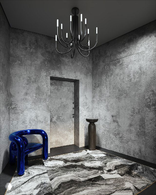 Интерьер прихожей в тёмных тонах с синим стулом и большой мраморной зоной на полу; грубая штукатурка на стенах и современная люстра завершают образ.