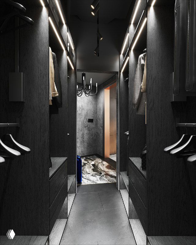 Вид коридора гардеробной с аморфным зеркалом, подвесным светильником и ковром у двери — контраст тёмного и светлого.