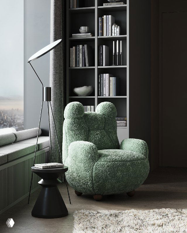 Уютное зелёное плюшевое кресло необычной формы у окна, рядом торшер и низкий столик, на фоне книжного стеллажа; зона для отдыха с мягкой текстурой.