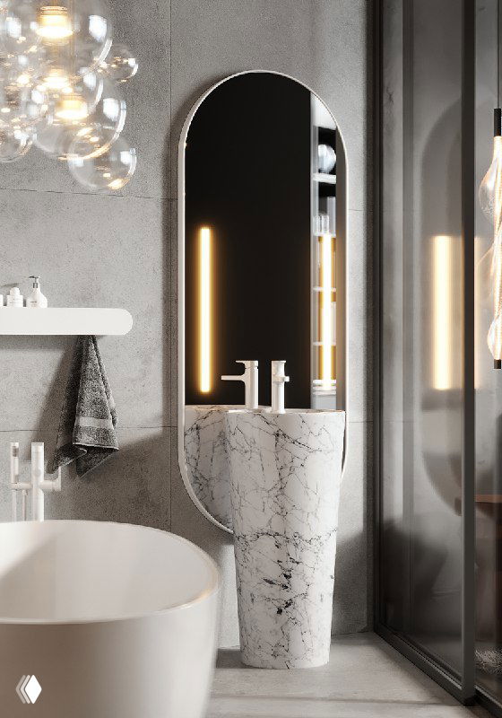 Педестальный мраморный умывальник у стеклянной перегородки с большим овальным зеркалом и мягкой вертикальной подсветкой в серой ванной.