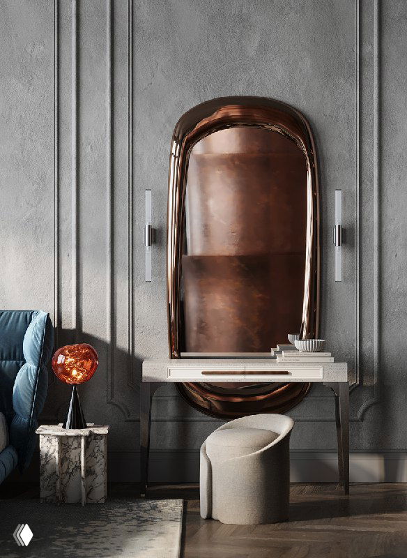 Макияжный столик с лаконичным пуфом и большим зеркалом в медной раме на фоне неоклассической отделки и декоративной подсветки в спальне.