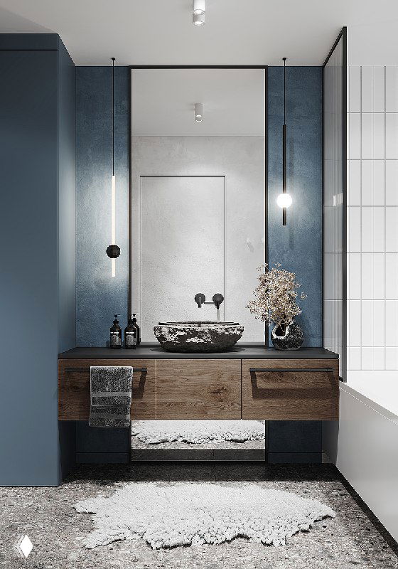 Общий вид синей зоны ванной с деревянной тумбой, зеркалом и подвесными светильниками — вертикальные решения создают ощущение высоты и горной палитры.