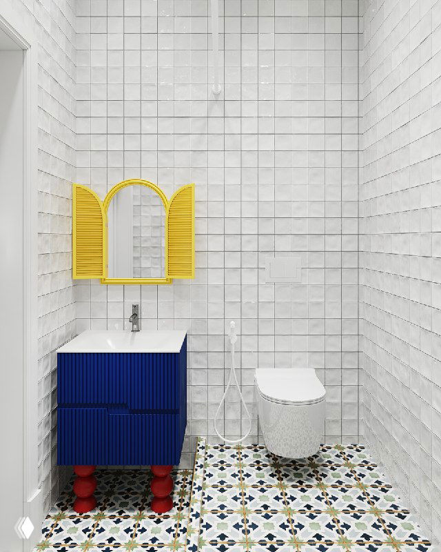 Общий вид компактного санузла: унитаз в душевой зоне, синяя тумба с красными ножками, жёлые ставни и белая мелкоформатная плитка по стенам.