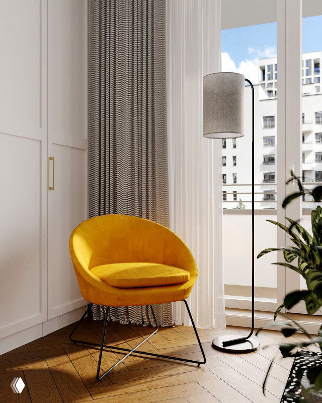 Уютный уголок кабинета с ярким желтым креслом у окна, деревянным полом и высокими шторами — образ заката в интерьере.