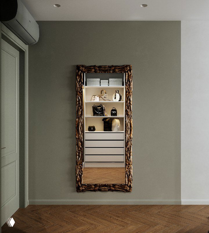 Большое настенное зеркало в декоративной раме на зелёной стене, рядом виден кондиционер и минималистичное декорирование ниши с полками.