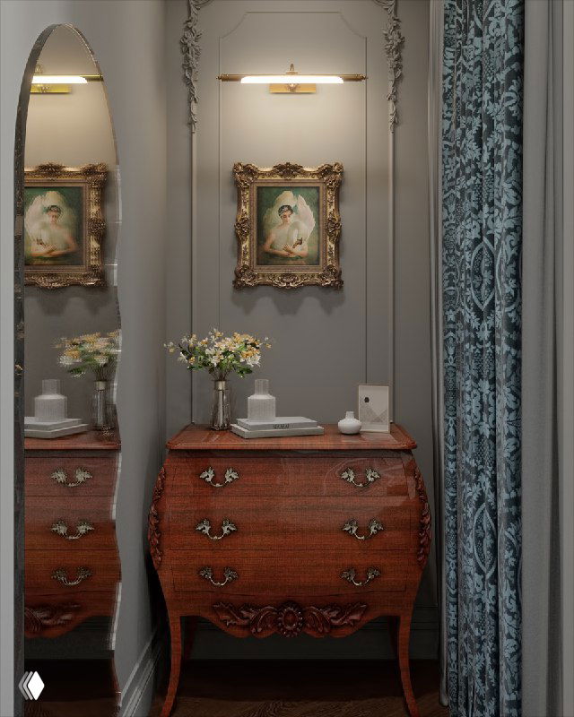 Вид узкого холла с антикварным французским комодом, резной рамой картины, лепниной на стене и направленной подсветкой в интерьере.