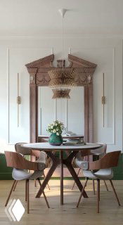 Обеденная зона с круглым столом и креслами, на фоне панелей стены и резного зеркала; видна декоративная люстра и зелёная ваза.