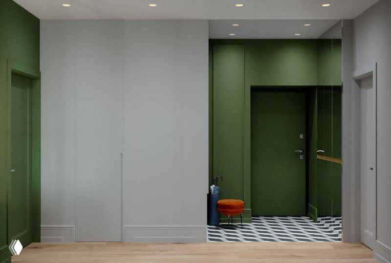 Интерьер прихожей: зелёная входная дверь, светлые стены, встроенные шкафы и чёрно‑белая геометрическая плитка на полу.