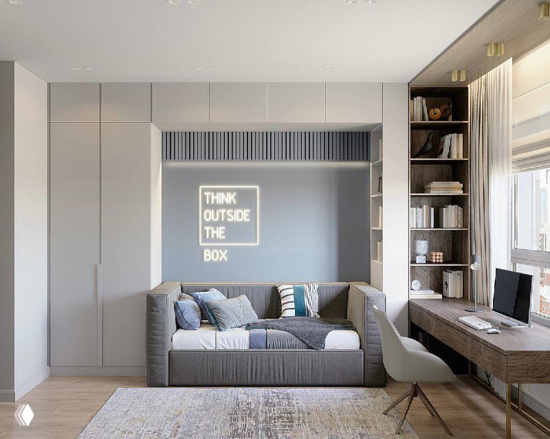 Интерьер детской комнаты: кровать с подъёмным механизмом и раскладной диван у стены, просторное рабочее место с письменным столом у окна и встроенные шкафы.