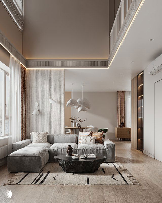 Общий вид просторной гостиной с высоким потолком, мягким диваном и столиком-скалой в центре, нейтральная палитра и текстуры.