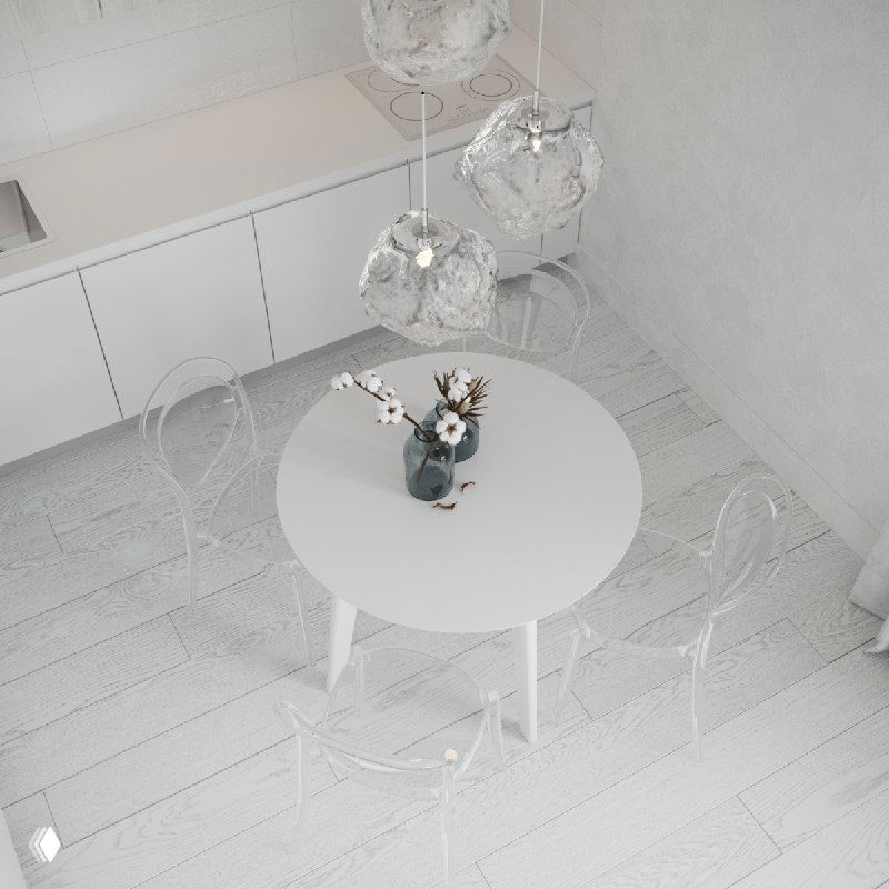 Аэрофото минималистичной белой кухни с круглым столом, прозрачными стульями и декоративной вазой — светлый интерьер с акцентом на простоту и искусство.