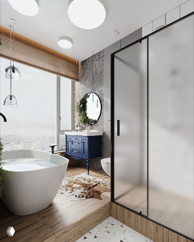 Ванная с панорамным окном, отдельно стоящая ванна, синяя тумба у окна и стеклянная душевая перегородка.