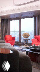 Фото кухни-гостиной: два красных кресла, низкий журнальный стол, панорамное окно и скрытый кухонный остров с техникой.