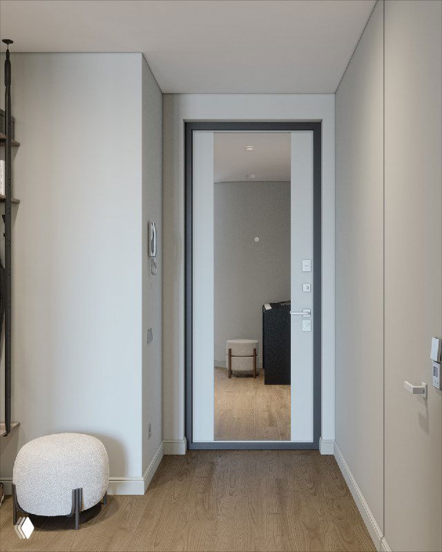 Вид от входной двери на прихожую с зеркалом во весь рост; аккуратный коридор, пуф у стены и открытое пространство, ведущее к кухне и гостиной.