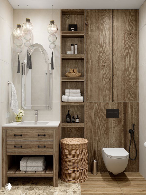 Интерьер небольшой ванной в тёплых древесных тонах: тумба с умывальником, этническое зеркало, открытые полки и плетёная корзина у подвесного унитаза.