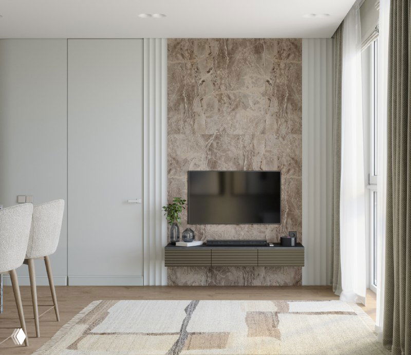 Зона ТВ с декоративной панелью из камня или мрамора, плоский телевизор, низкая тумба и текстильный ковер в светлой палитре.