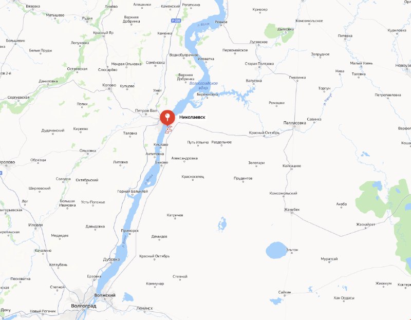 Скриншот карты с отметкой небольшого городка на берегу Волги, видны русло реки, населённые пункты и дорожные связи вокруг.