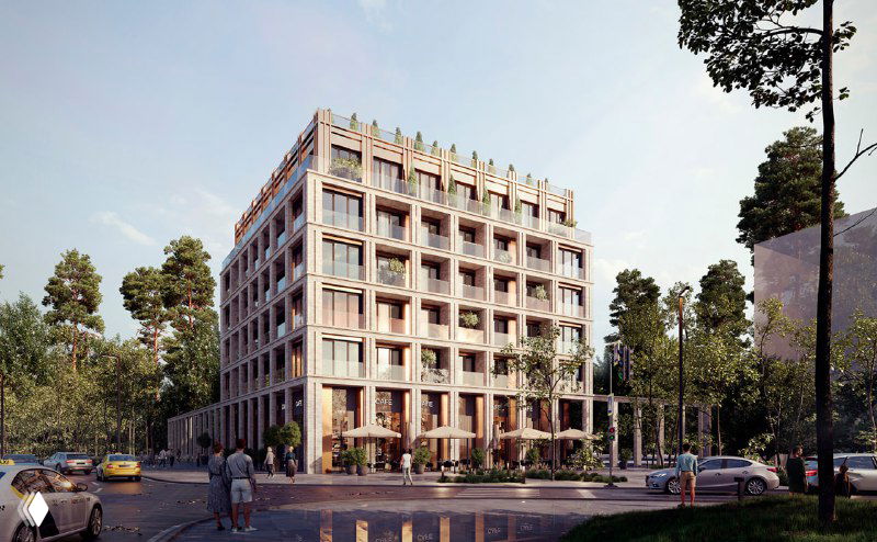 Низкоэтажный корпус в квартале «МЫС» с крупными окнами и коммерческими этажами, окружённый деревьями и озеленением.