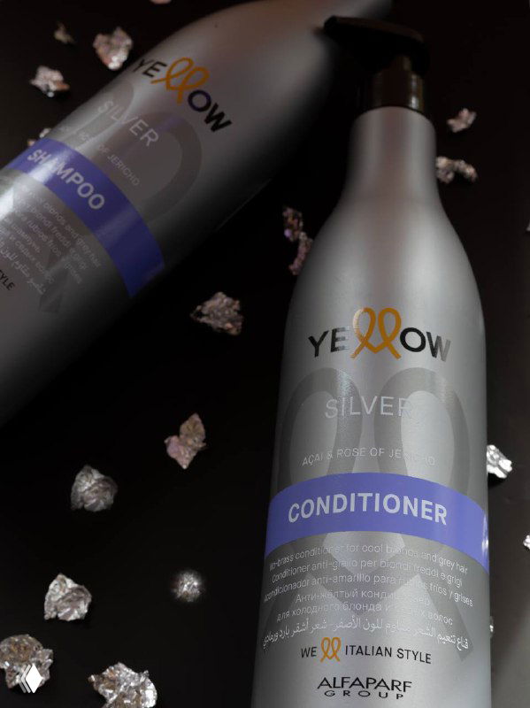 Серебристые бутылки Yellow Professional (шампунь и кондиционер) на тёмном фоне с блестящими акцентами и фирменным логотипом.