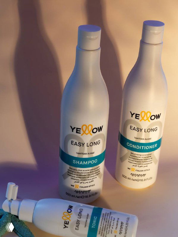 Два флакона Yellow Professional серии Easy Long на тёплом фоне: шампунь и кондиционер с длинными тенями и приятной подсветкой.