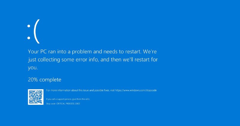 Скриншот классического синего экрана смерти Windows: синий фон, грустный смайлик, текст о перезагрузке и QR‑код внизу, показывающий прежний дизайн BSOD.