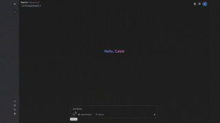 Тёмный скриншот рабочего пространства с текстом приветствия в центре «Hello, Caleb», минималистичный UI и панель действий внизу экрана.