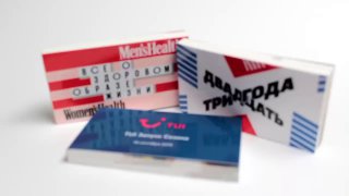 Три печатные флипбук‑книжечки на белом фоне; видны обложки с графикой и названиями, демонстрирующие продукт флипбук‑фотозоны и сувенирный формат.