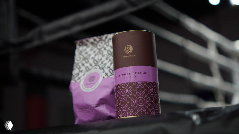 Фотография упаковки конфет бренда «Филинити» в фиолетовой коробке и тубусе на тёмном фоне, к новости о сертификации.