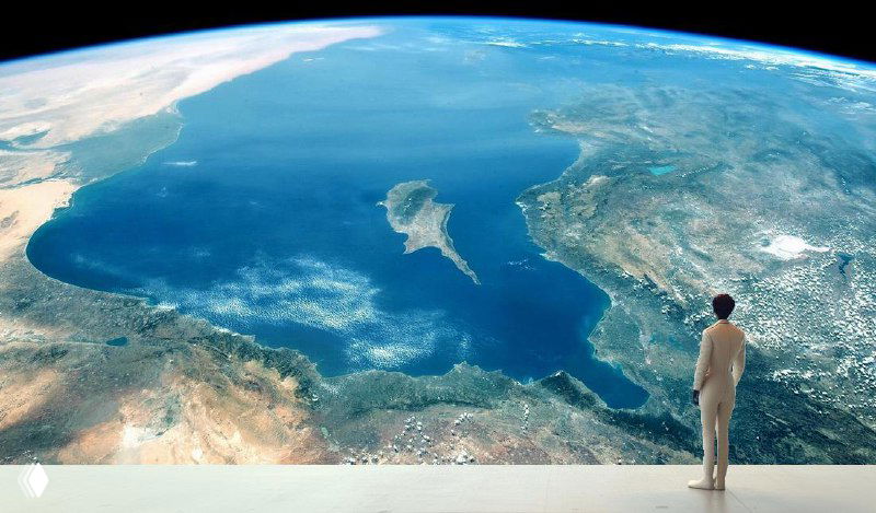 Businessperson overlooking an aerial view of the Mediterranean and Cyprus from a futuristic observation platform, symbolic of startup growth.