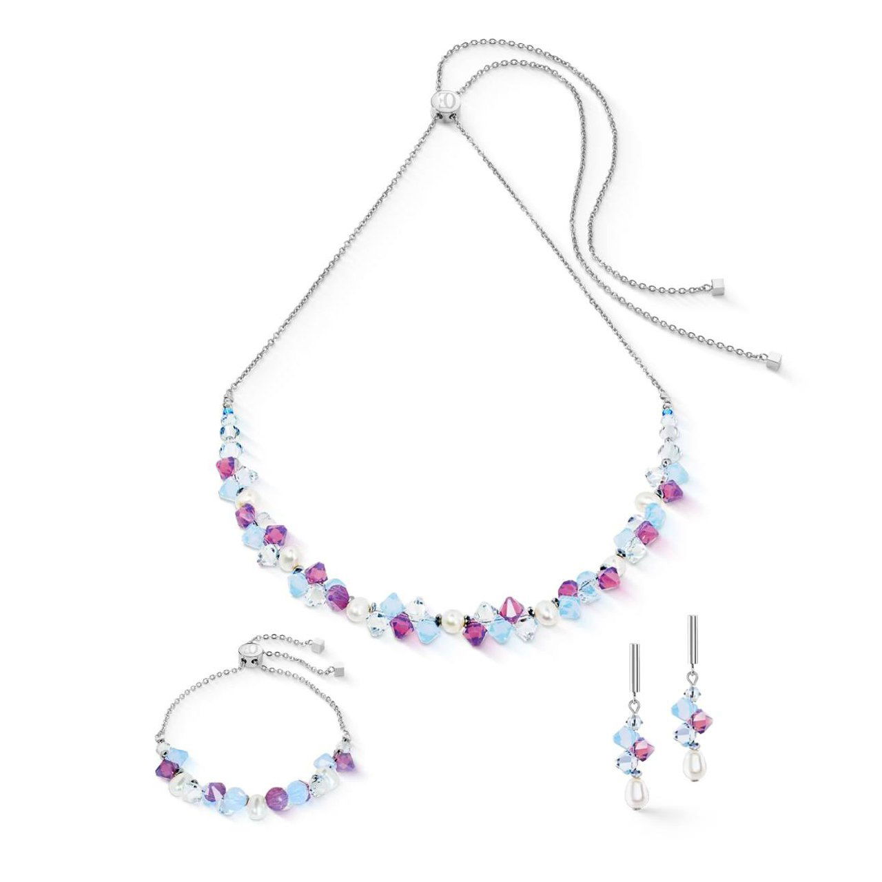 Сет Coeur de Lion в синей гамме: тонкое колье и браслет с синими и фиолетовыми бусинами, серьги-капли, студийная белая подложка для каталога Rosone.