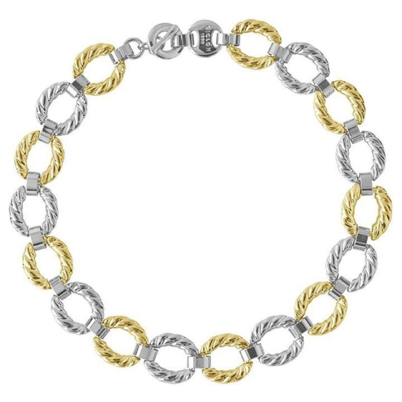 Студийная фотография круглых звеньев колье с комбинированной золотистой и серебристой отделкой — товарный снимок с видом замка