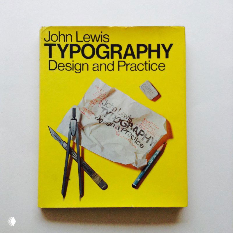 Изображение ярко-жёлтой обложки книги 'Typography' John Lewis с изображением инструментов дизайна и чертежей на переднем плане.