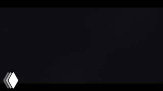 Кадр из короткометражки «Patience»: тёмный минималистичный план с акцентом на свет и шейдинг; внизу слева видно маленькое лого.