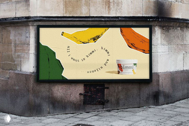 Макет наружной рекламы с упаковкой Bimmi на борде и большими абстрактными цветными пятнами (фрукты/формы), пример применения графики в средовом брендинге.
