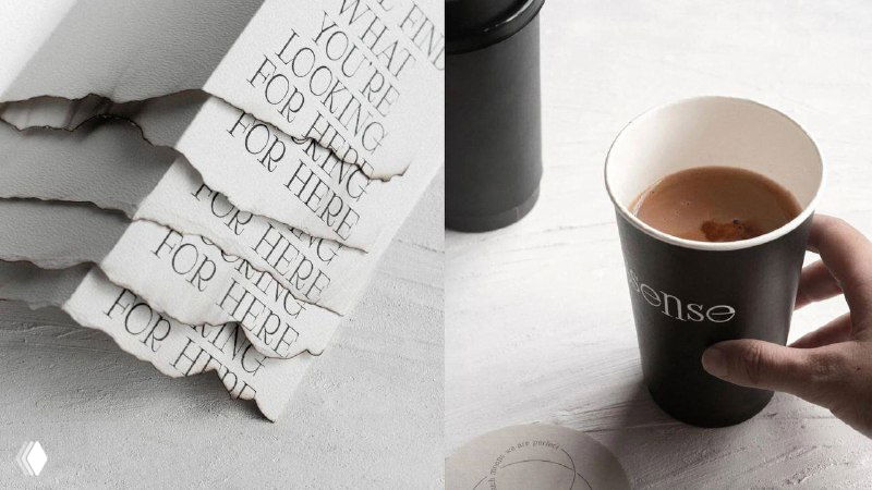 Рука держит чёрный стакан с кофе рядом с бумажной упаковкой и фирменной типографикой; сцена подчёркнута минималистичной чёрно‑белой эстетикой и текстурами.