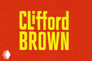 Вертикально сжатая и удлинённая жёлтая надпись «Clifford Brown» на оранжевом фоне, пример стилизации букв для афиши.