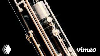 Детализация клавиш и трубок инструмента крупным планом; стеклянные и металлические осколки летят в пространстве, мрачный фон и световые блики.