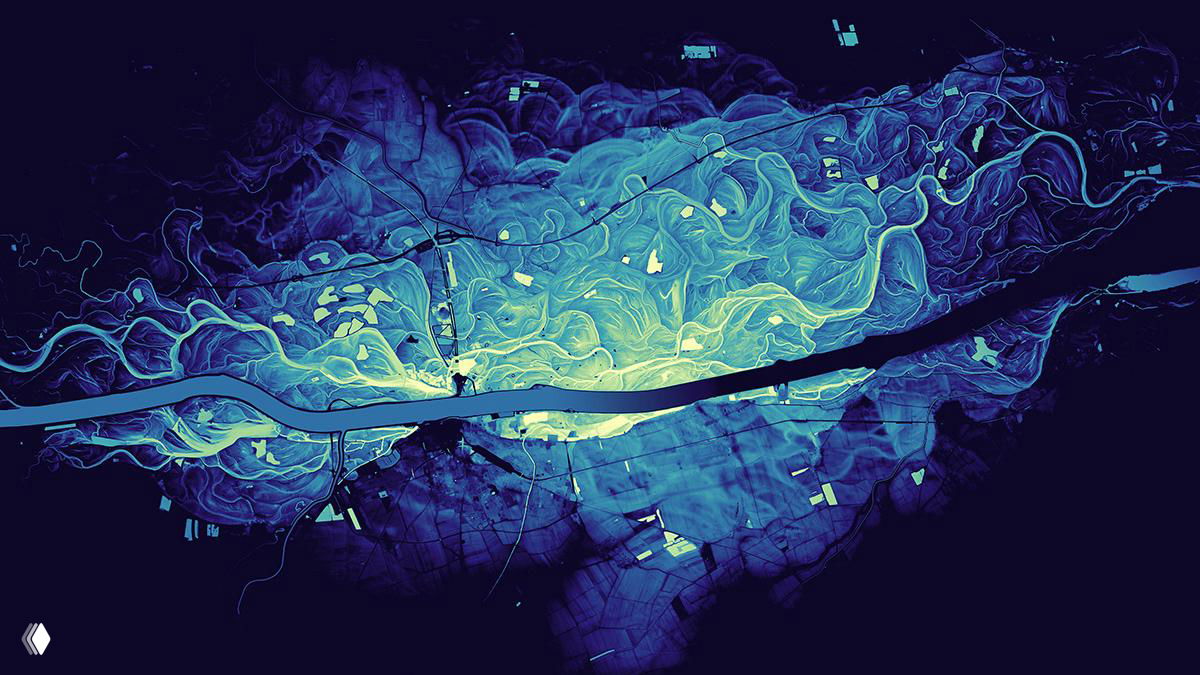 Аэрофотоподобная карта с голубой палитрой иллюстрирует разветвления рек и протоков на однотонном фоне, подчёркивая основные водные артерии.