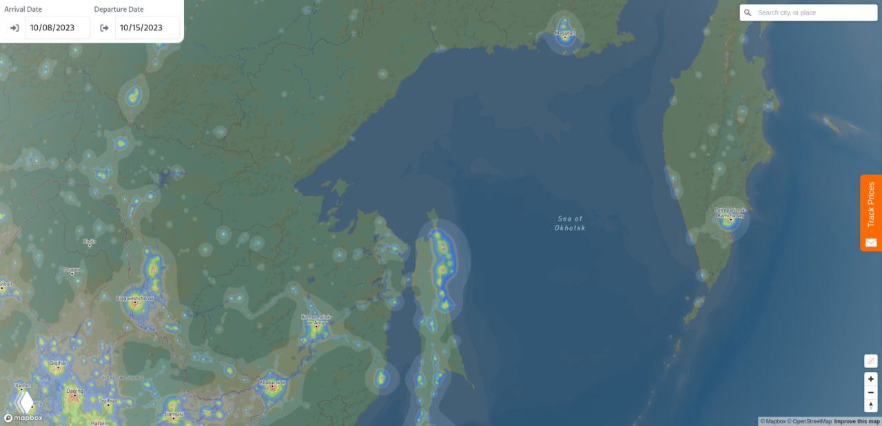 Дальний восток России и побережье Охотского моря на карте: изолированные острова и прибрежные источники света на тёмном фоне моря.