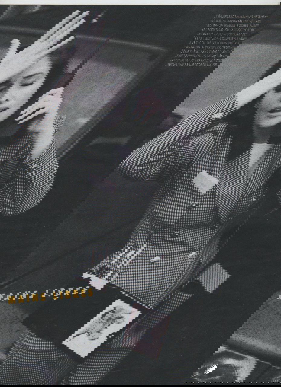 Чёрно‑белый архивный портрет Розмари Макгроты в кресле с ретро‑мобильным телефоном, журнальная съёмка в стиле начала 1990‑х.