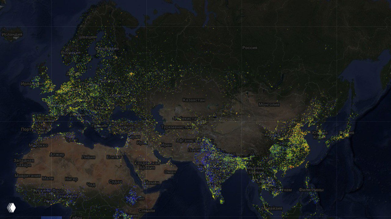 Карта GlobalBuildingAtlas: спутниковая панорама с цветными точками, показывающая распределение 2,75 млрд трёхмерных моделей зданий.