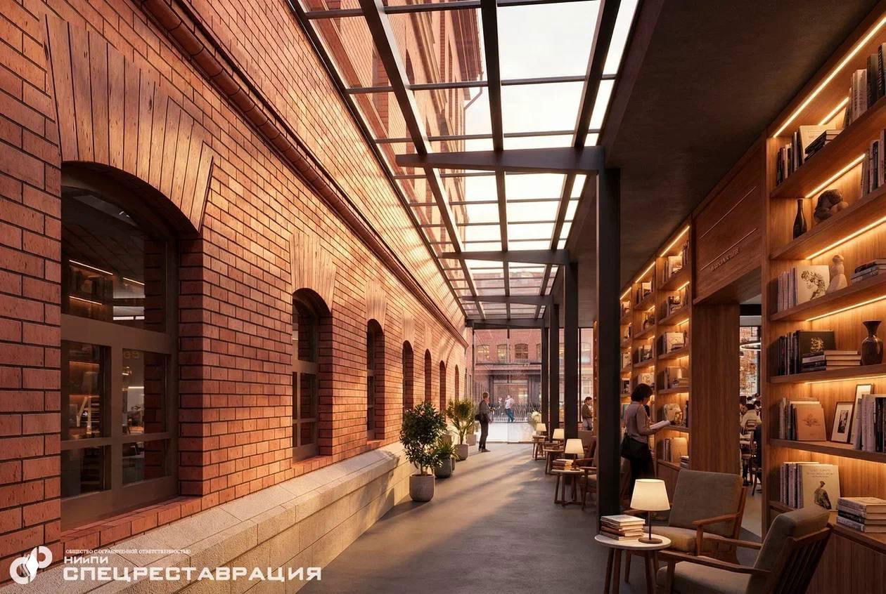 Внутренний переход в проекте реконструкции «Крестов»: кирпичные стены, стеклянный навес, книжные полки и кафе‑зоны — концепт общественного пространства.