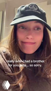 Селфи женщины в чёрной кепке с наложенным английским текстом «really wish I had a brother for you guys...», тёплый тон, реалистичная обработка, домашняя сцена