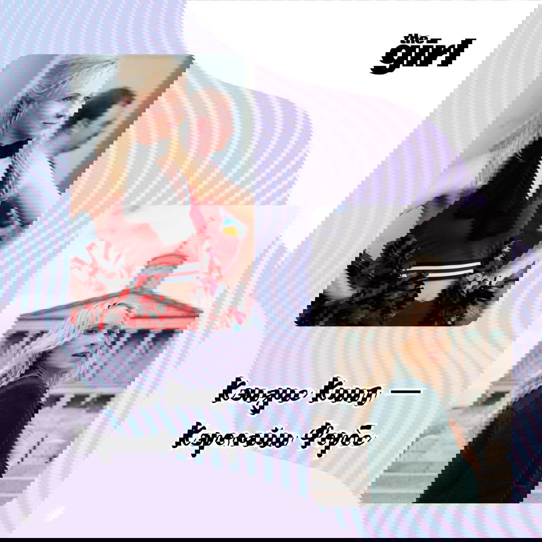 Современное портретное фото женщины с длинными тёмными волосами и чёлкой, в строгом тёмном пиджаке, нейтральный студийный фон.