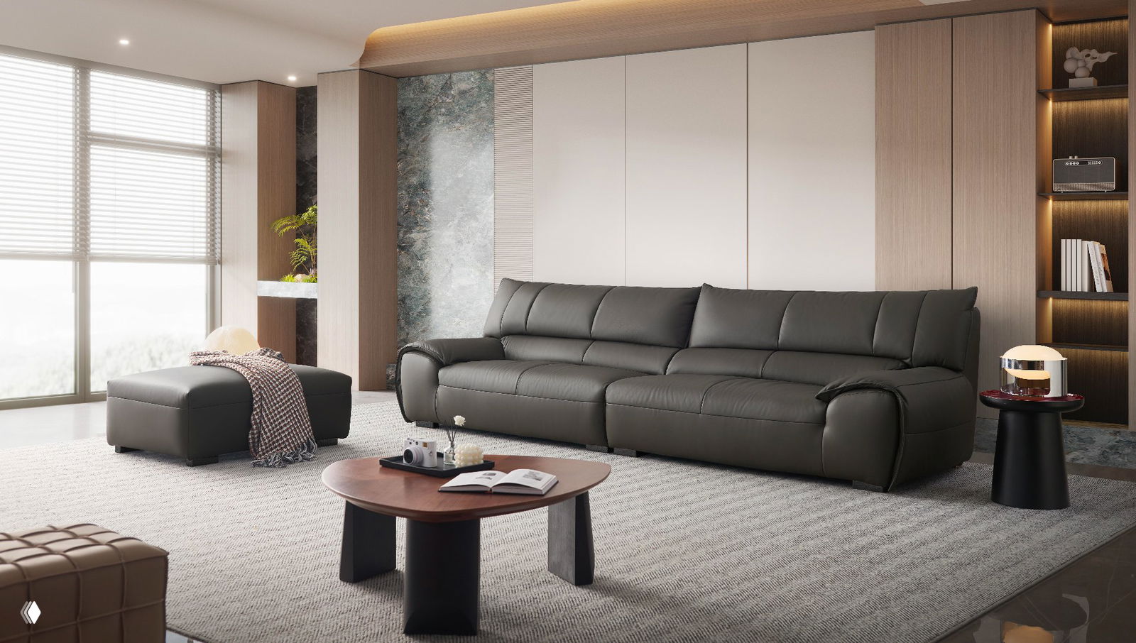 Фотография современного тёмно‑серого кожаного дивана с пуфом в светлой гостиной; видны деревянные панели и журнальный столик